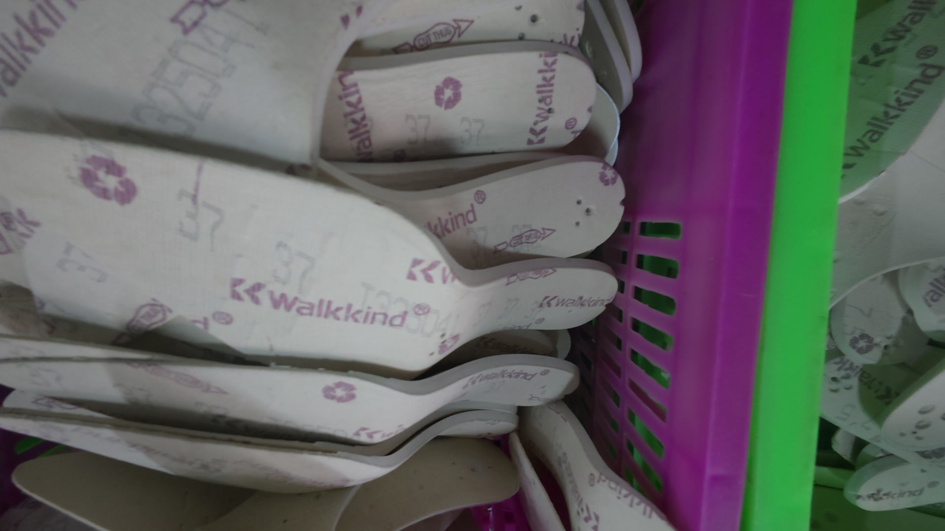 Finished injection-moulded PP midsoles ready for the next operation
